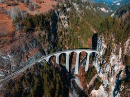 Aerial view famous mountain in Filisur, Switzerland. Landwasser Viaduct - world heritage photo