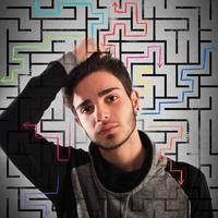 Thoughtful teenager stuck in a maze photo