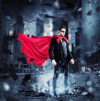 City superhero with red cape photo