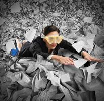 Bureaucracy concept with sea of paper photo