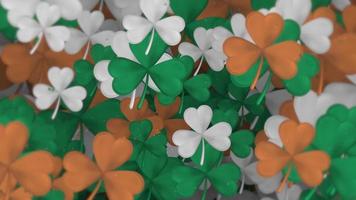 Saint Patricks Day background with gently moving shamrocks and particles in the green, white and gold colors of the Irish tricolor flag. This textured motion background is full HD and a seamless loop. video