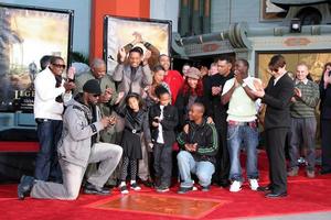 Will Smith with his family  Friends  and Tom CruiseWill Smith Handprint and Footprint Ceremony Graumans Chinese Theater ForecourtDecember 10 2007Los Angeles CA2007 photo