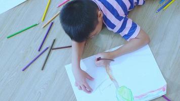 Asian boy sleeping and drawing video