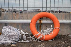 Safety flotation ring on water storage and water treatment area, for emergency action. The photo is suitable to use for safety background photography, power plant poster and electricity content media.