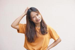 Asian woman having itchy head from dandruff photo