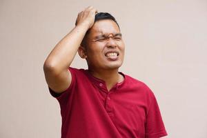 Asian man has a headache stress from work photo