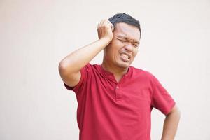 Men have itchy scalp from dandruff. photo