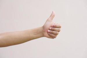 Asian woman doing her hand as a great sign photo