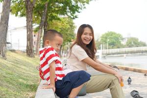 Mother and son having a happy conversation in the garden photo