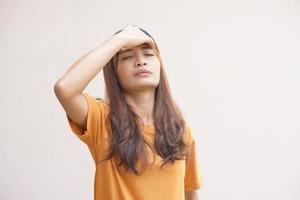 Asian women suffer from headaches from thinking about work. photo