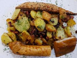 three different kind of smoked fish with roasted potatoes photo