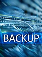 Backup button on modern server room background. Data loss prevention. System recovery. photo