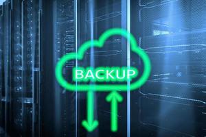 Backup button on modern server room background. Data loss prevention. System recovery. photo