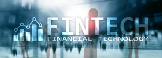 FINTECH - Financial technology, global business and information Internet communication technology. Skyscrapers background. Hi-tech business concept. photo
