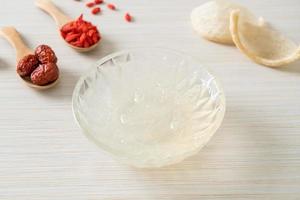 Edible bird's nest soup in glass bowl photo