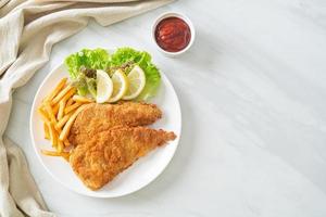 Homemade Breaded Weiner Schnitzel with Potato Chips photo