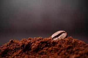 Closeup of coffee beans at the mixed heap of roasted coffee with copy space for text. Concept of Coffee freshness photo