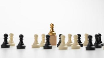 Close up of hands of a business man moving king golden chess to defeat  opponent the chess game is development analysis, strategy, and plan, the  management or leadership concept. 22804709 Stock Photo