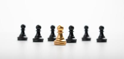 Golden Chess pawn standing in front of other chess, Concept of a leader must have courage and challenge in the competition, leadership and business vision for a win in business games photo