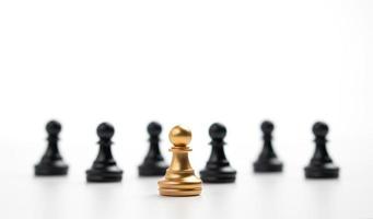 Golden Chess pawn standing in front of other chess, Concept of a leader must have courage and challenge in the competition, leadership and business vision for a win in business games photo