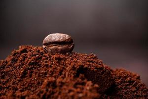 Closeup of coffee beans at the mixed heap of roasted coffee with copy space for text. Concept of Coffee freshness photo