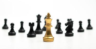 Golden Chess King standing to Be around of other chess, Concept of a leader must have courage and challenge in the competition, leadership and business vision for a win in business games photo