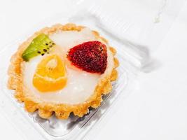 Fruit pie, strawberry, kiwi and orange isolated on white background photo