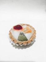 Fruit pie, strawberry, kiwi and orange isolated on white background photo