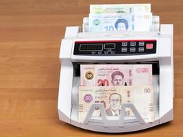 Tunisian money in a counting machine photo