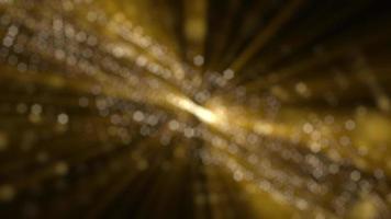 Golden glitz and glamour background animation with flowing glittering gold bokeh particles and shimmering light rays. This glitzy motion background is full HD and a seamless loop. video