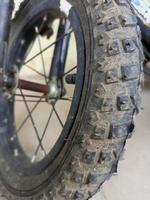 Dirty kid's bicycle tire muddy photo