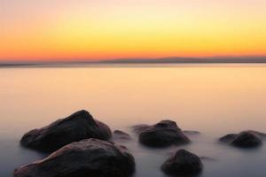 sunset over the sea background photo