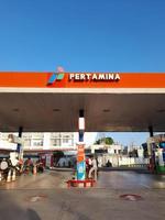 Mataram City, Lombok Island, Indonesia. March 15, 2023. The Pertamina logo is seen at a Pertamina gas station in downtown Mataram City on the Lombok Island. photo