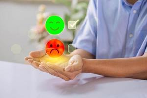 Customer service and satisfaction concept. Businessman choosing 5-star and happy smile face icon to give satisfaction in service for evaluation product service quality, feedback review, good quality. photo