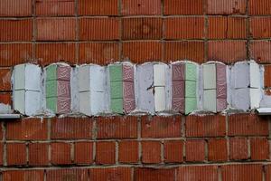 decoration red wall of the house with tiles. photo