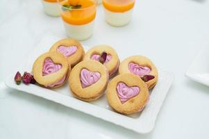 Desserts at the candy bar for valentine's day, shortbread in the shape of a heart photo