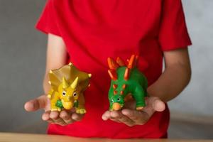 A child plays with animal figures photo