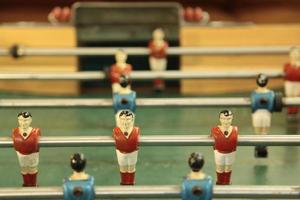 Close-up on the figures of a foosball photo