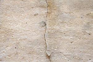 Close-up on a cracked concrete wall photo