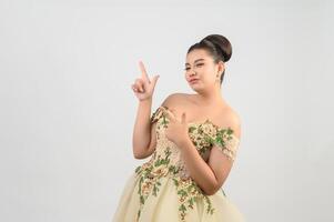 Young asian beautiful bride point finger with happy on white background photo