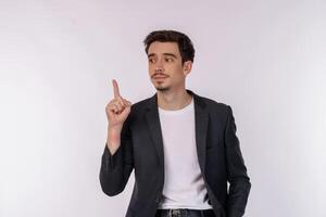 Portrait of thinking man surrounded by question mark on isolated background photo