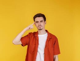 Portrait of thinking man surrounded by question mark on isolated background photo