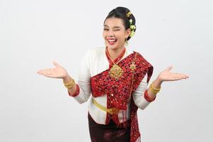 Young beautiful woman dress local culture in northern with show product gesture photo
