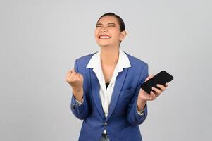 Young beautiful woman in formal clothing for officer use smartphone posture photo