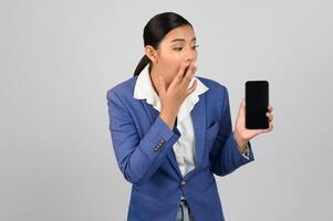 Young beautiful woman in formal clothing for officer use smartphone posture photo