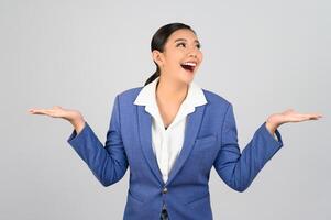 Young beautiful woman in formal clothing for officer open palms posture photo