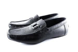 par de negro masculino clásico Zapatos en blanco antecedentes foto