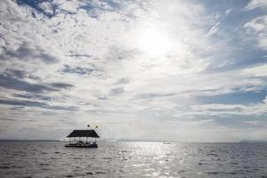 Floating in the water at sunset. photo