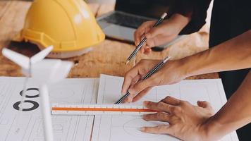 Construction and structure concept of Engineer or architect meeting for project working with partner and engineering tools on model building and blueprint in working site, contract for both companies. video