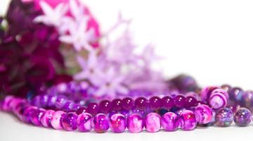 feminine and romantic pearls and flowers in violet tone photo